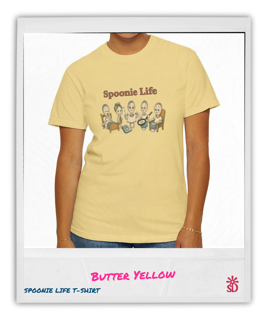 Butter yellow t-shirt with 'Spoonie Life' graphic design on a person wearing it.